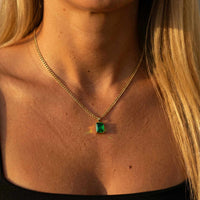 Thumbnail for Emerald Pendant Necklace by Brother & Sisters featuring a stunning emerald green stone set in gold.