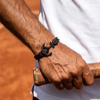 Thumbnail for Black Anchor Bracelet – holding a tennis racket | Brother & Sisters | SKU: 3621358-gun-black-XS-14-15, 3621358-gun-black-S-16-17, 3621358-gun-black-M-18-19, 3621358-gun-black-L-20-21, 3621358-gun-black-XL-22-23