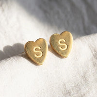Thumbnail for Heart Initial Stud Earrings in Gold, macro detail of the metal and the finish | SKU: heart-initial-gold-a
