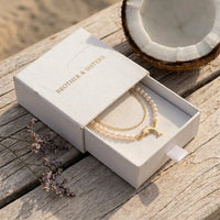 Thumbnail for Pearl Dolphin Anklet Set presented in the white Brother & Sisters gift box, gold dolphin charm and freshwater pearls.