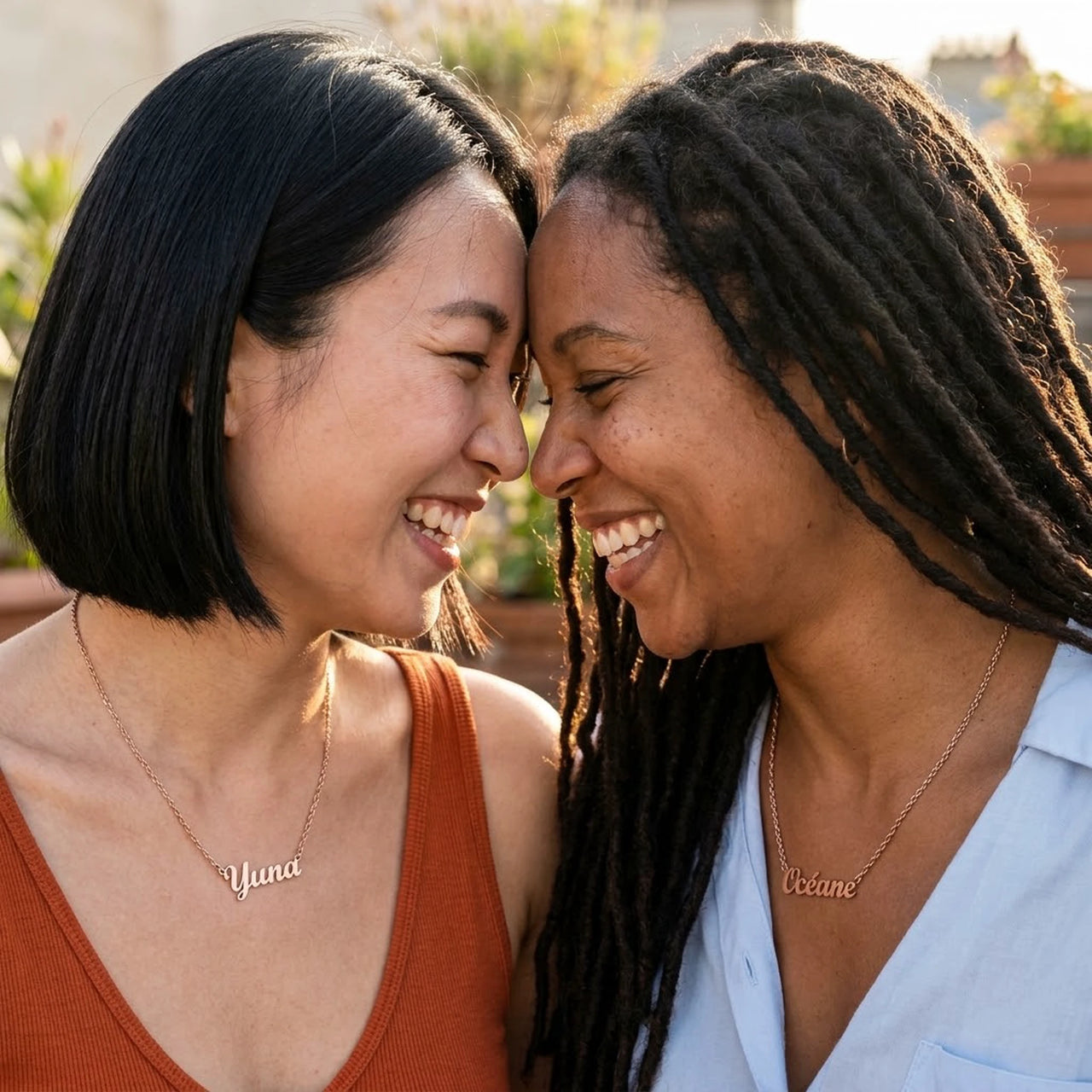 Minimalist Name Necklace in rose gold worn by two women laughing together, the name Yuna and Oceane | SKU: minimalistnn-rosegold