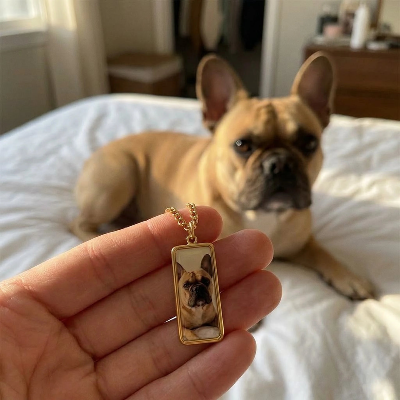 Customer photo: the gold bar necklace with her bulldog's photo, her dog in the background | SKU: TPH-BARN-GOLD