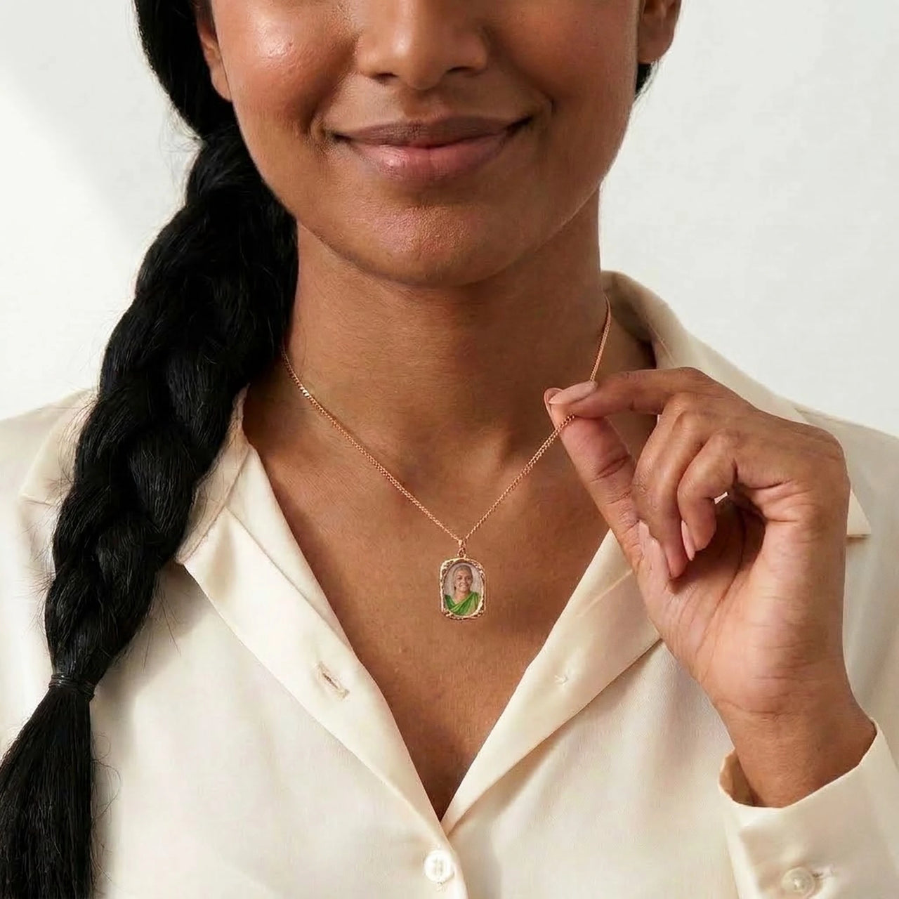 Woman wearing the rose gold oval photo necklace with her grandmother's photo | SKU: TPH-OVLN-ROSEGOLD