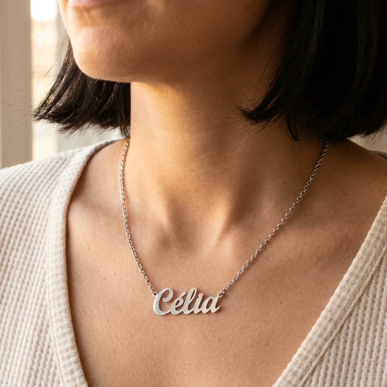 Minimalist Name Necklace in silver worn at the collarbone, the name Celia | SKU: minimalistnn-silver