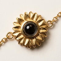 Thumbnail for Sunflower Personalized Photo Bracelet Gold - macro of the sunflower charm and its photo projection lens - Brother & Sisters